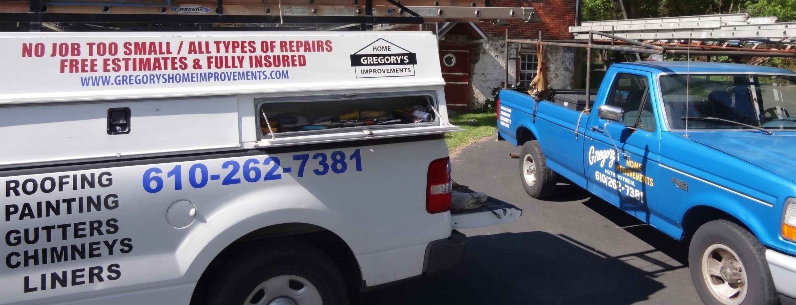 Gregory’s two work trucks: a white pickup lettered Roofing, Painting, Gutters, Chimneys, Liners and a blue pickup loaded with ladders