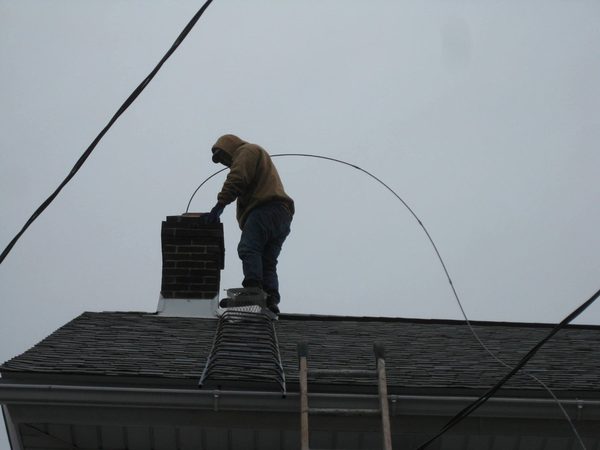 Chimney repair on a roof
