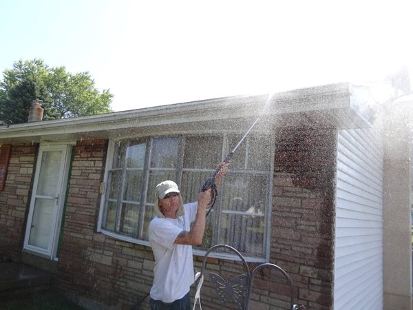 Power washing a brick house